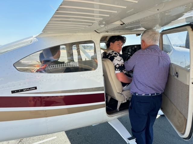 A young pilot takes the controls during a Young Eagles flight